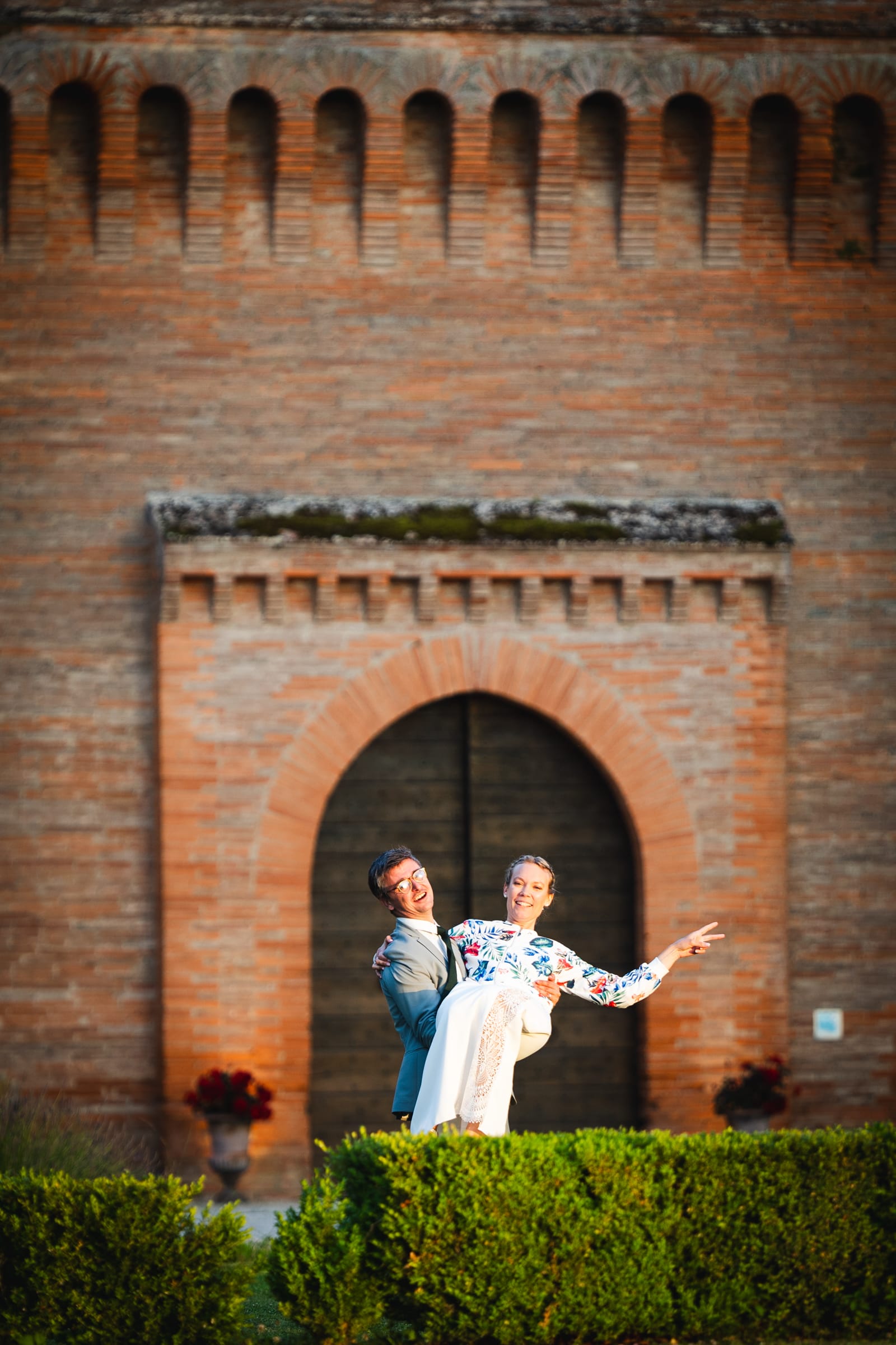 fun photo of the newlyweds at the chateau door