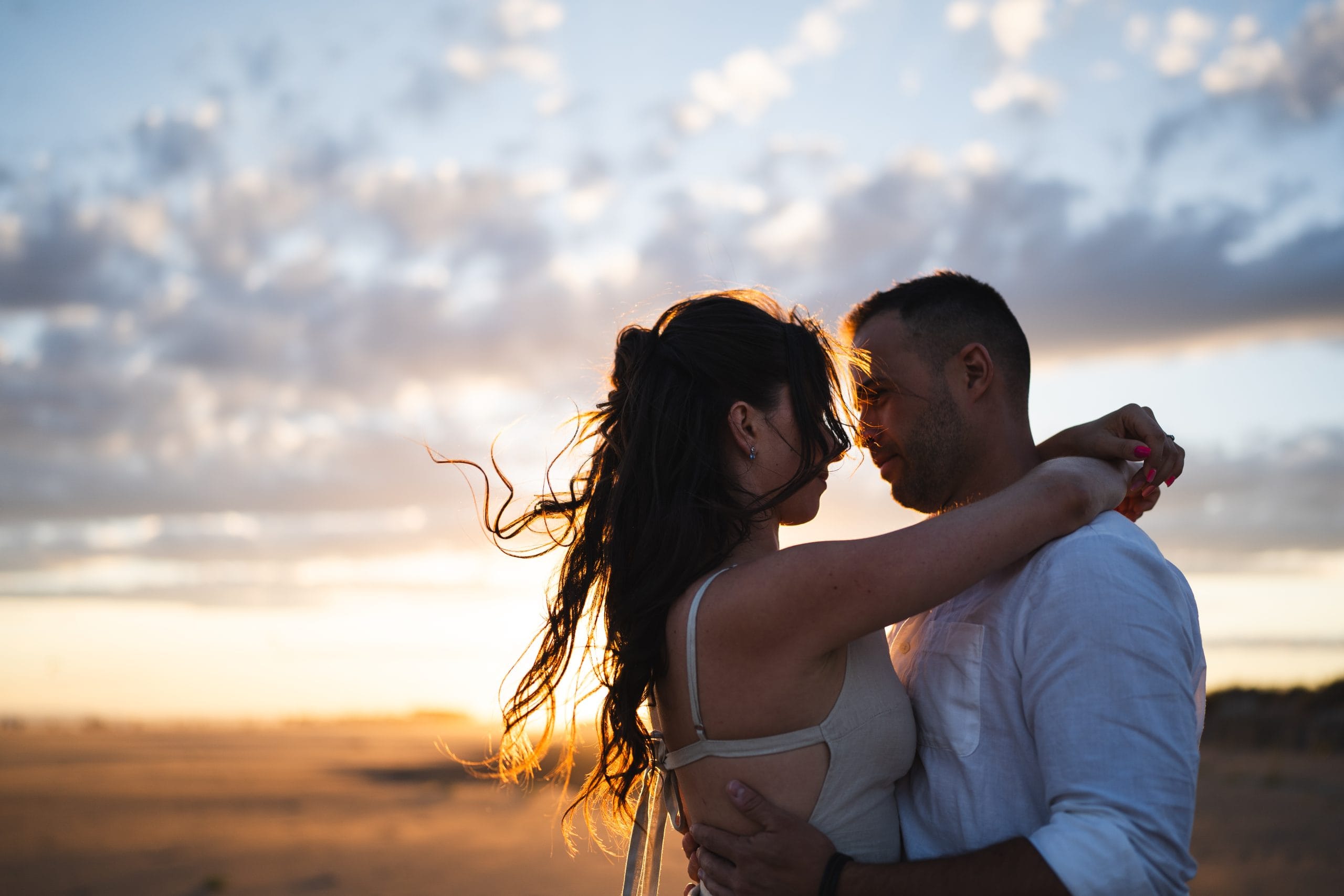 Tender looks exchanged during an engagement session at the Espiguette beach, Mediterranean