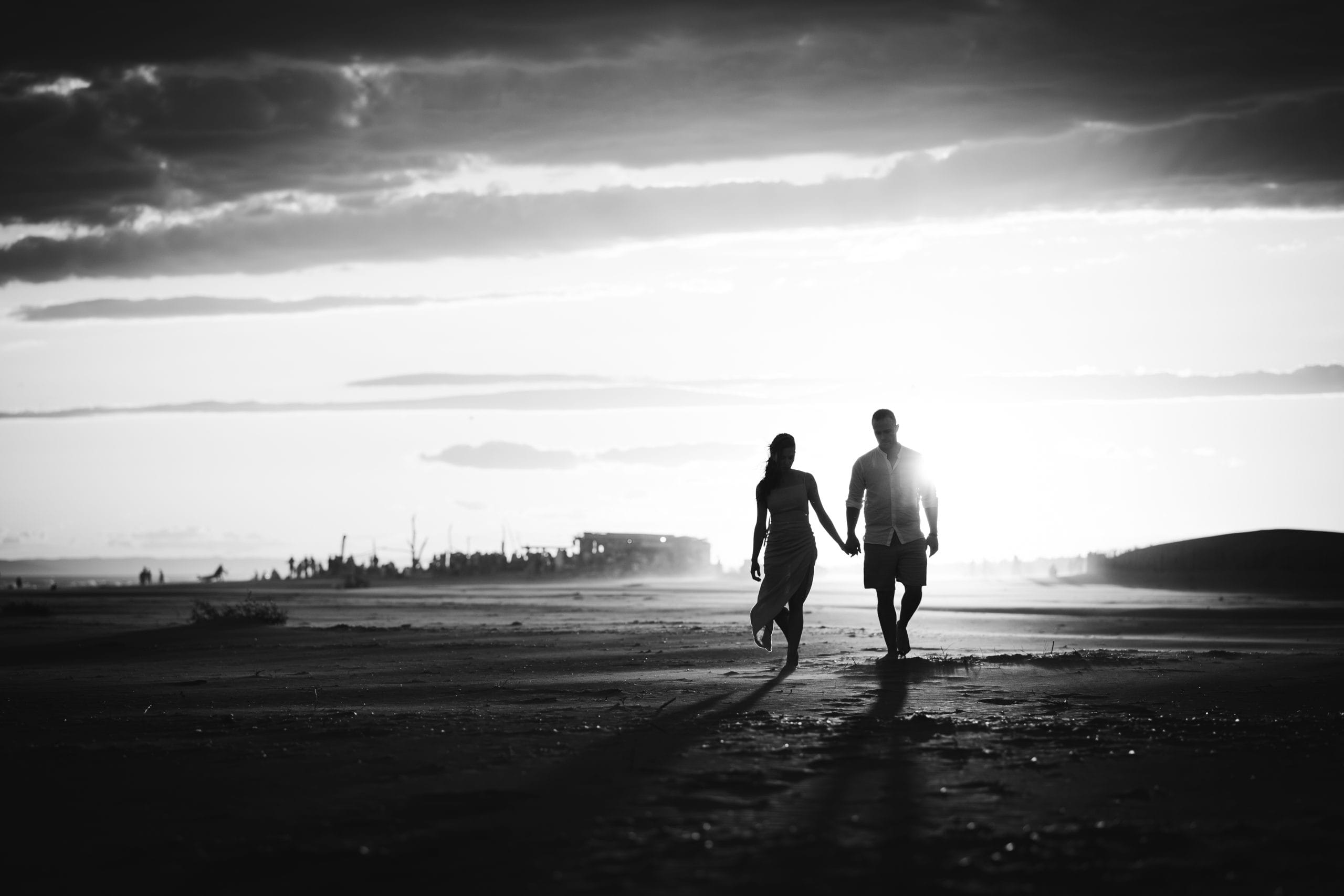 Couple silhouette hand in hand at sunset - Mediterranean engagement session Espiguette