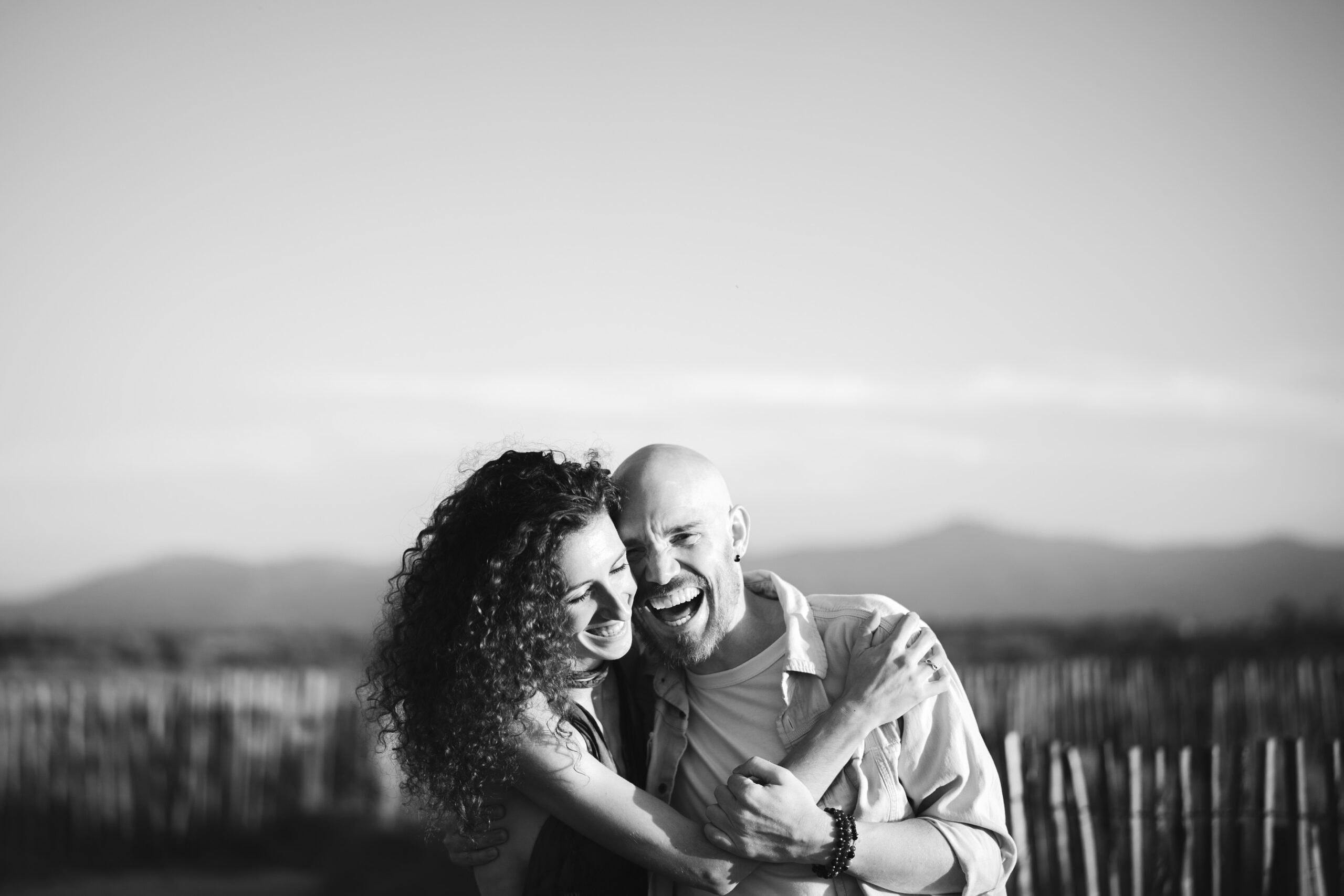 A couple bursting into laughter during a couple's photo shoot in the South of France