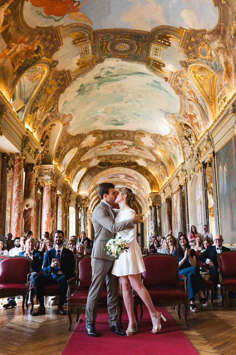Emotional moment during the civil ceremony in the Salle des Illustres at the Capitole de Toulouse