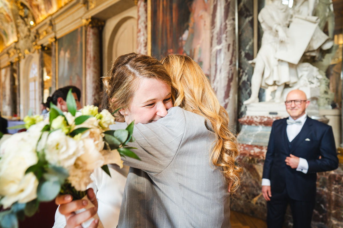 The bride embracing her mother after the civil ceremony at the Capitole de Toulouse