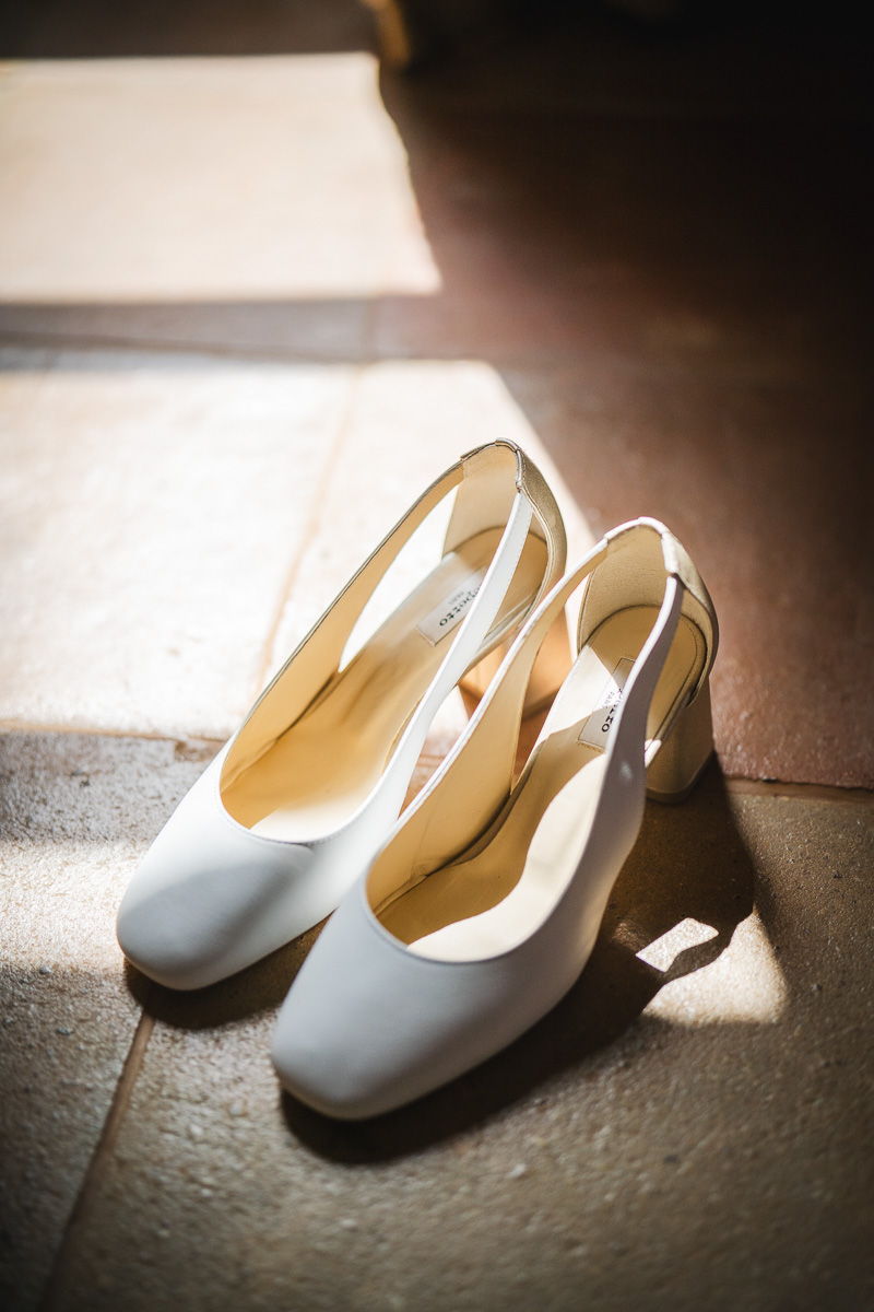Detail of the groom's shoes during preparations at La Bélonie, Tarn