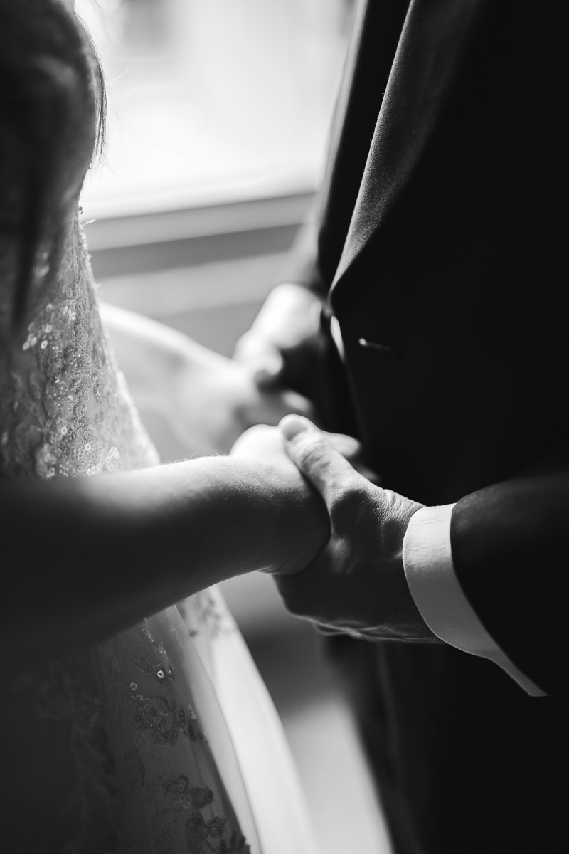 Couple holding hands during the first look, La Bélonie, Tarn