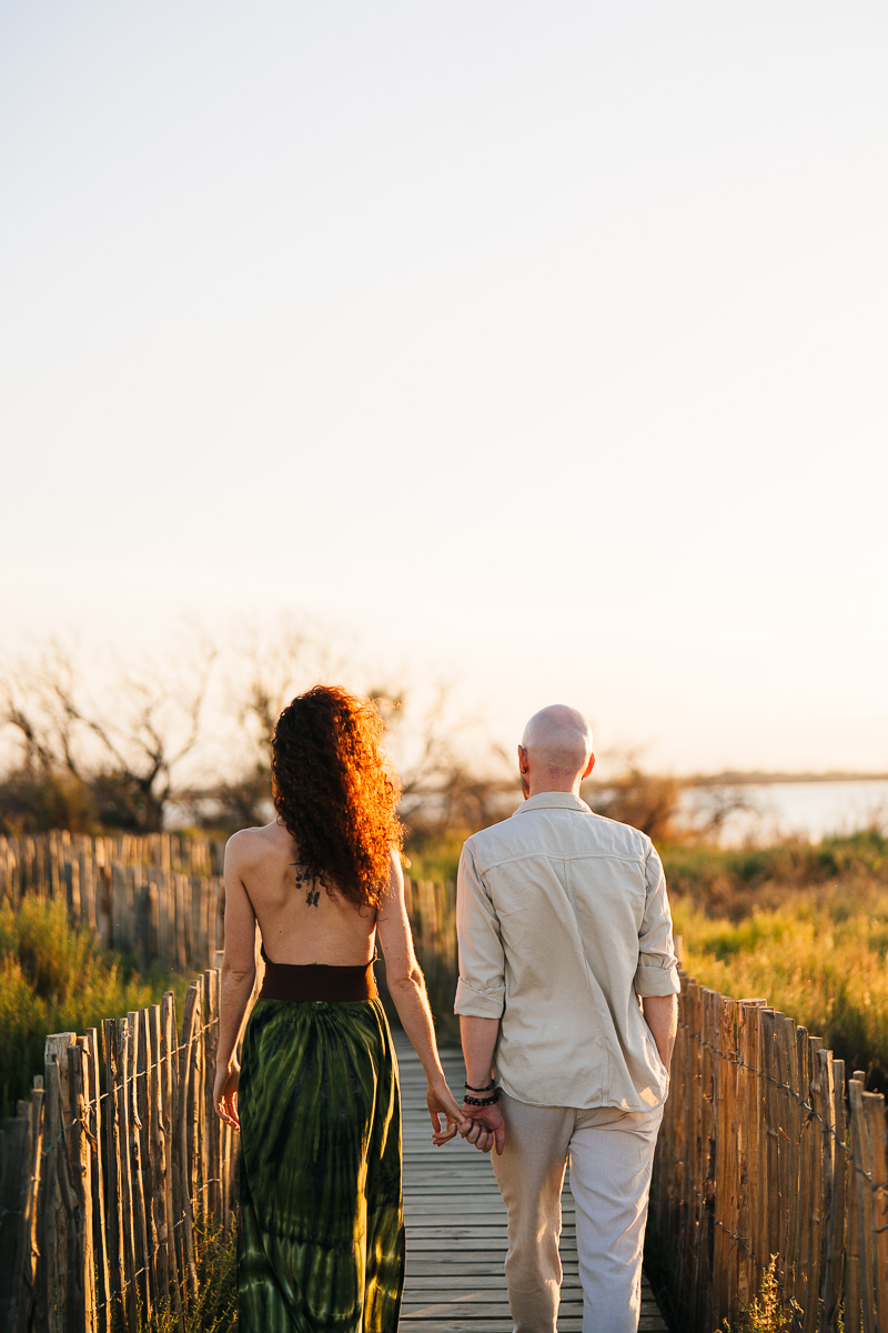 Couple walking along the Étang de Canet, engagement session near Perpignan, Pyrénées-Orientales
