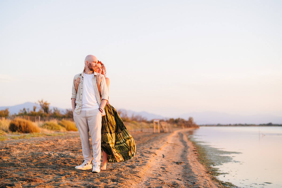 Couple embracing at golden hour, Étang de Canet near Perpignan