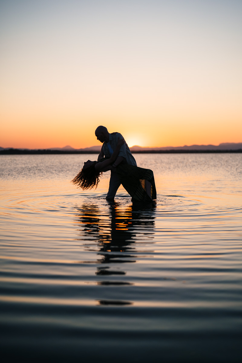 Couple embracing during their engagement session at the Étang de Canet, Pyrénées-Orientales