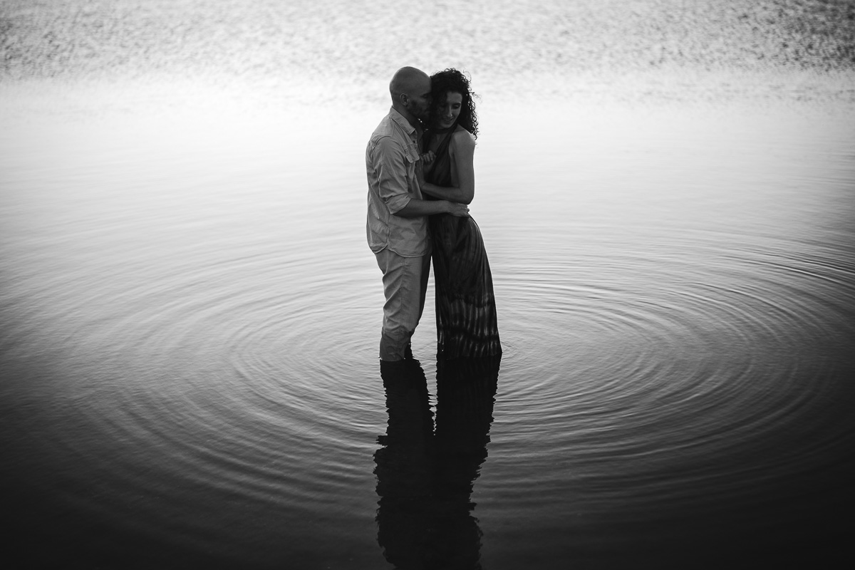 Black and white couple silhouette at golden hour, Étang de Canet near Perpignan