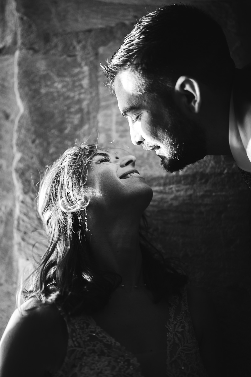 Married couple in natural light at Tour Carbonnière, intimate black and white portrait