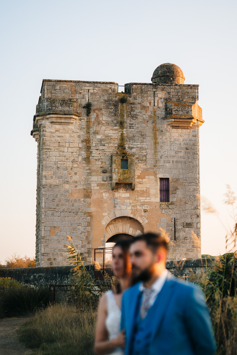 Married couple at the foot of Tour Carbonnière during sunset in Camargue