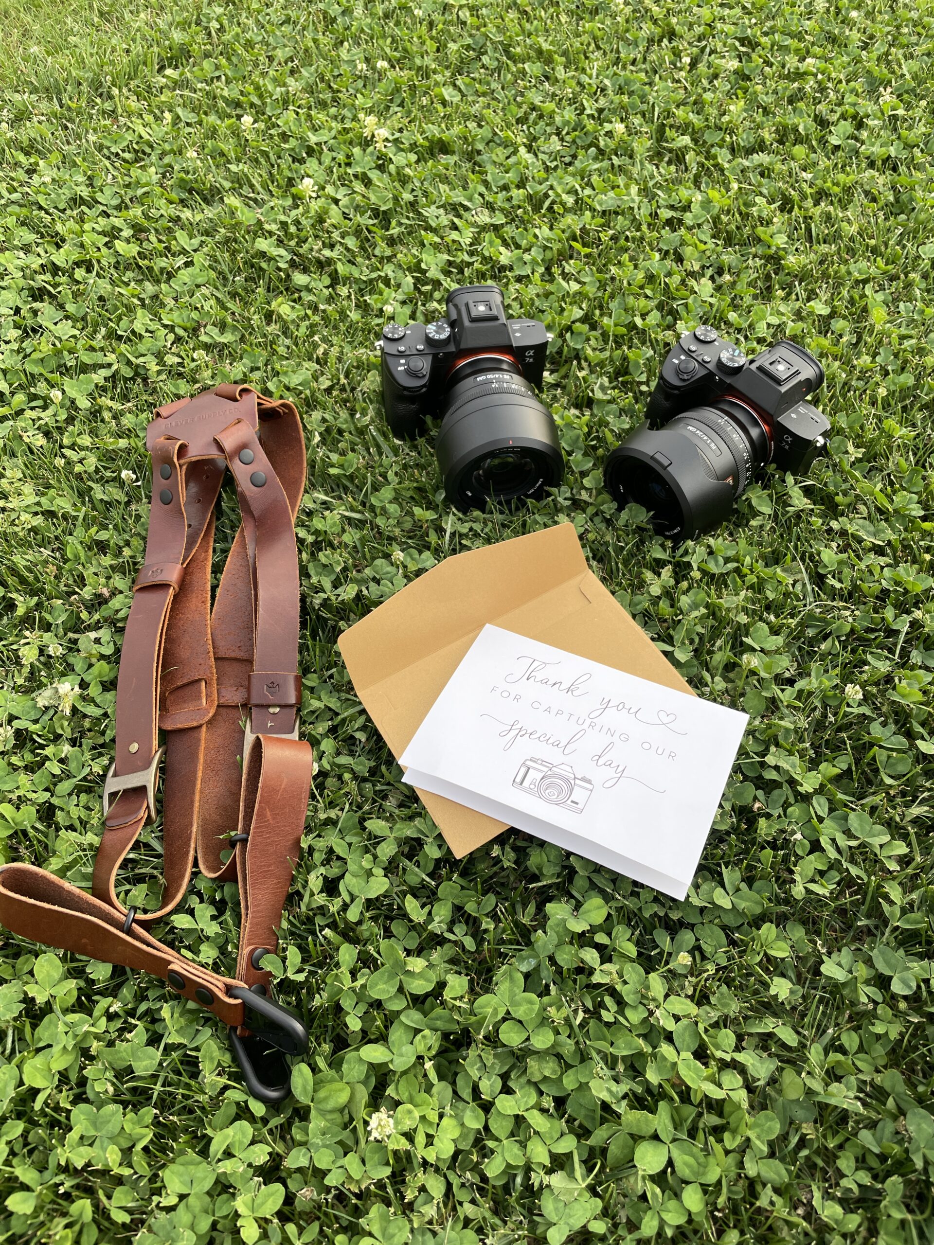 Camera gear and harness after Julie and William's wedding, with their handwritten thank-you card