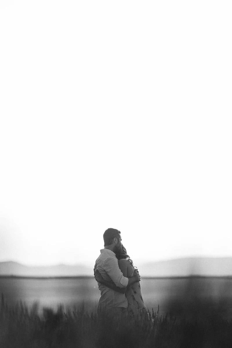 Silhouette of a couple embracing in a lavender field at dusk, Valensole, black and white