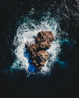 Graphic close-up of a rock in the middle of the Mediterranean Sea on the Costa Brava