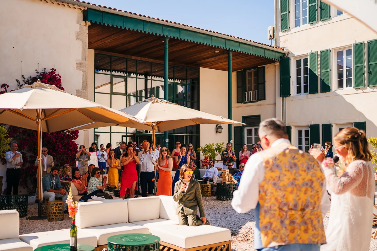 Guests gathered for the wedding speeches in the courtyard