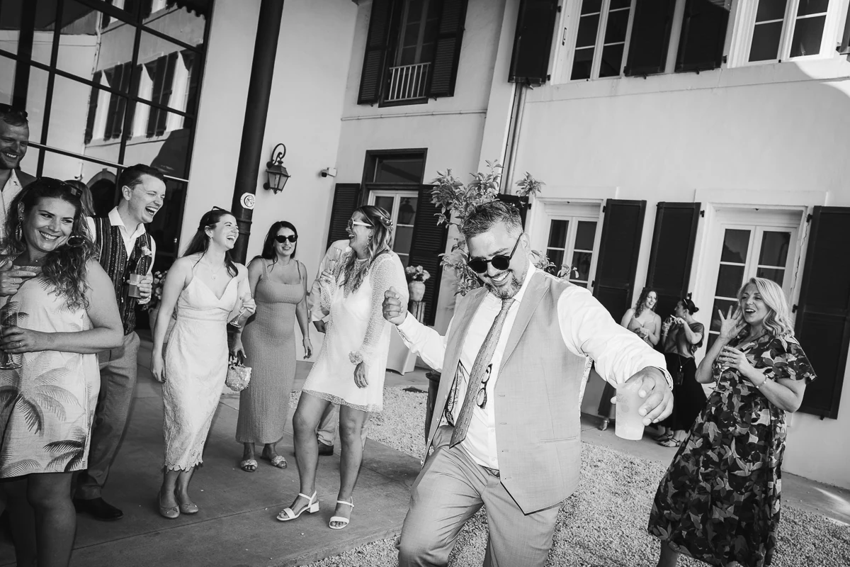 bride and groom dancing together black-and-white