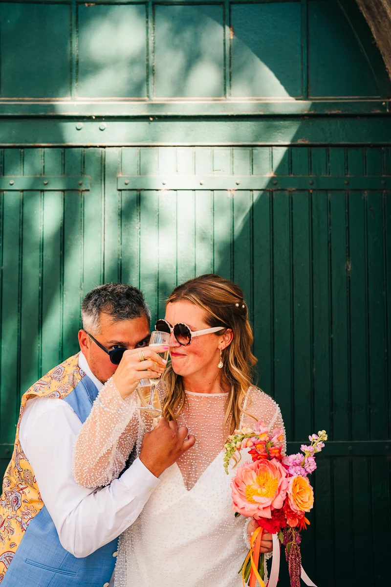 Bride and groom couple session with champagne