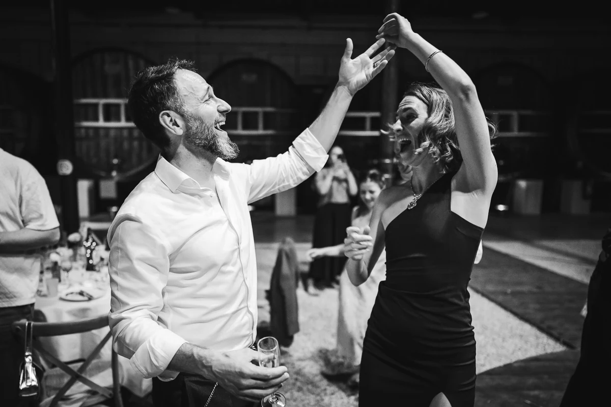 Black and white photo of guests dancing together