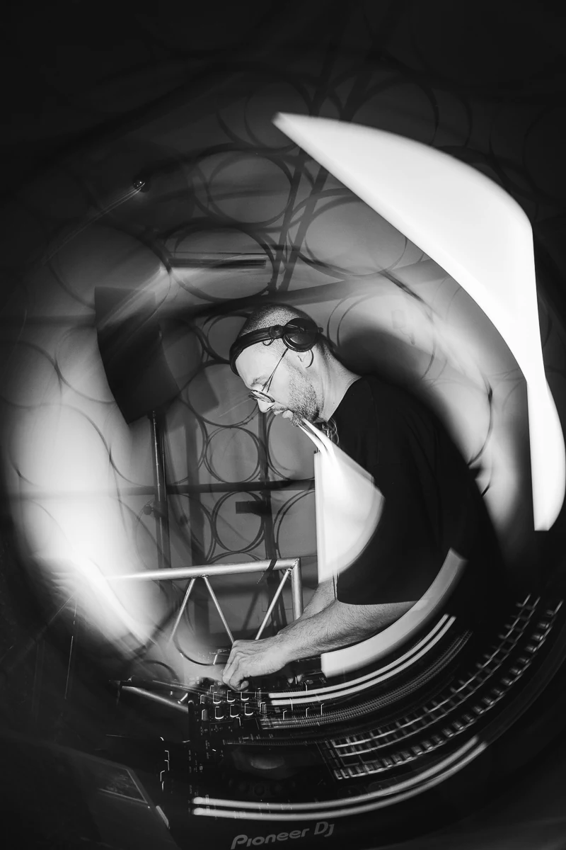 Black and white blurred motion photo of the dj working - Mamour DJ