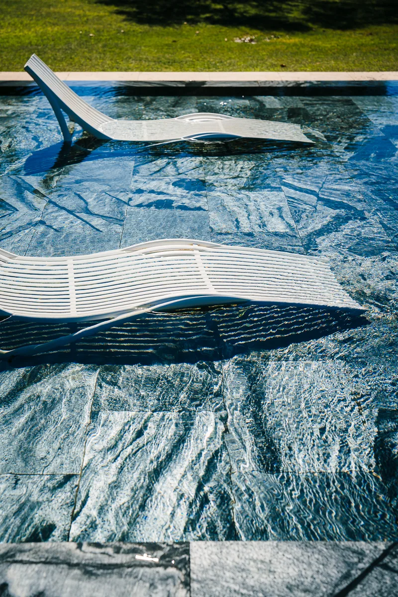 White sunloungers in the pool at Domaine de la Trinité, wedding venue near Montpellier