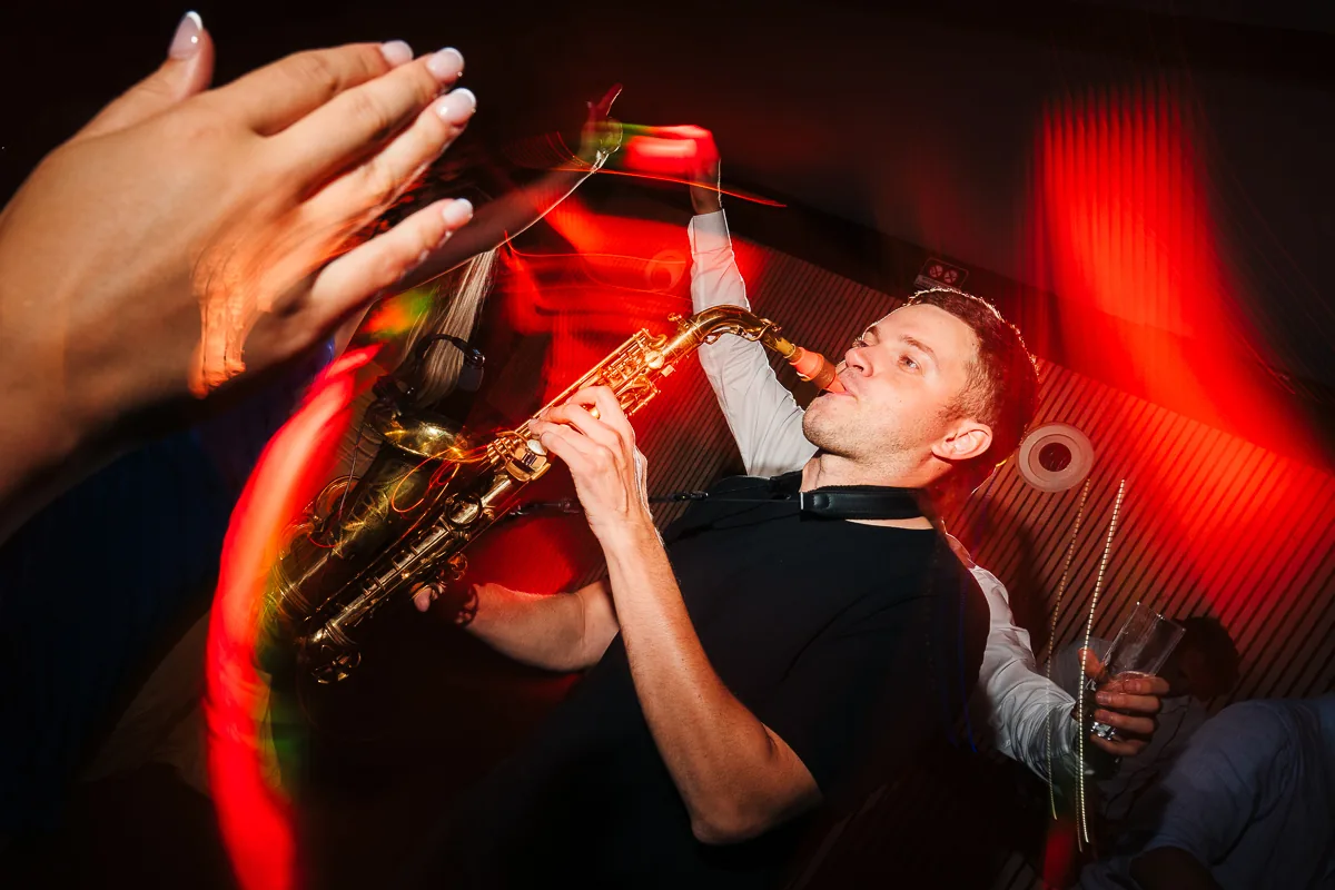 Saxophonist playing live on the dance floor at a wedding at Domaine de la Trinité near Montpellier